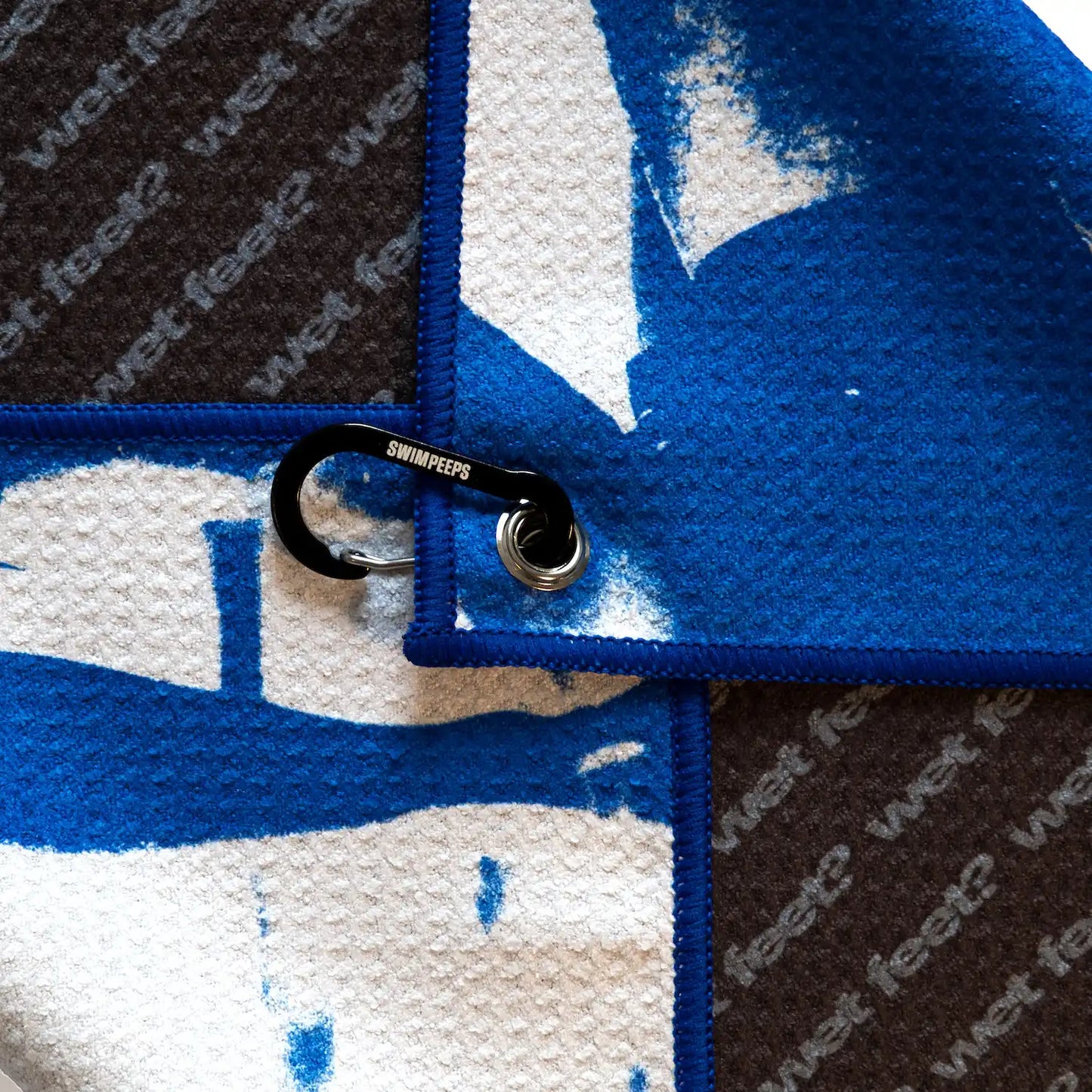 Swim Peeps Dry Step swim changing mat, blue and off-white, design close-up on white background.