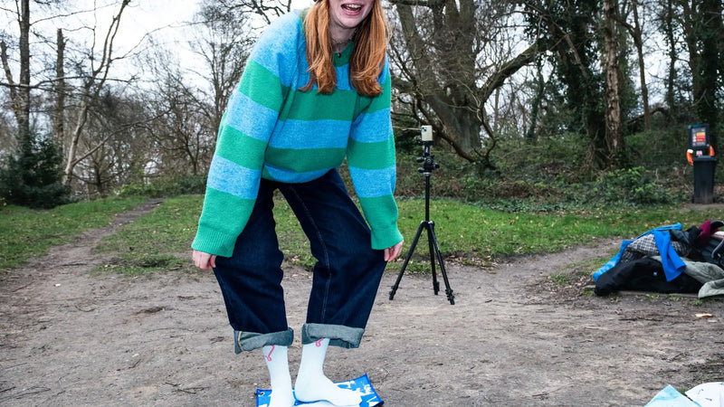 Urban swimmer standing on a Swim Peeps Dry Step Swim Changing Mat