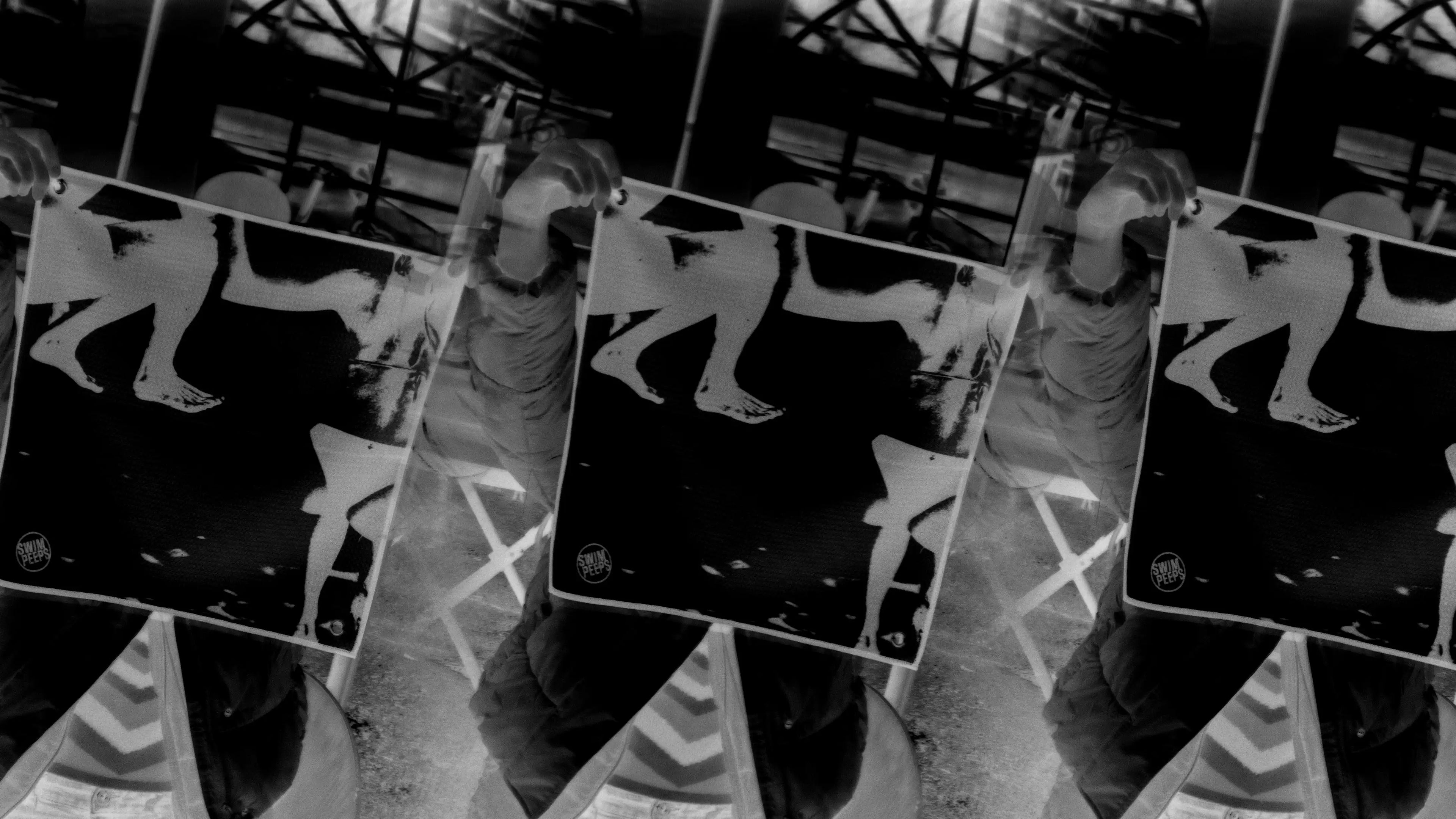 Black and white collage of a person holding up the Swim Peeps Dry Step Swim Changing Mat