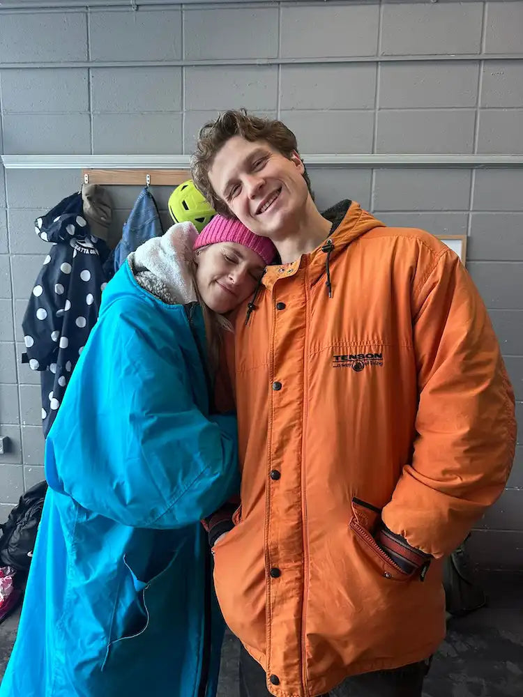 London swim club members embracing after a cold water swim